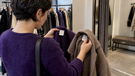 Shopper checks labels inside wool garments