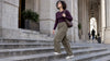 Woman wearing cargo pants and a fitted plum top