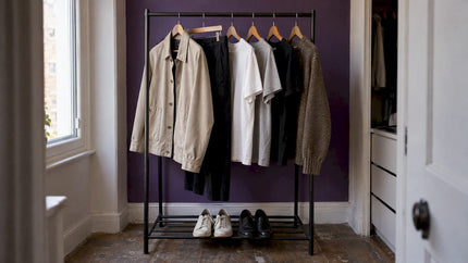 Everyday wardrobe essentials on a clothing rack