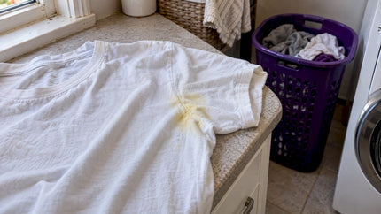 Yellow underarm stain on a white cotton T-shirt