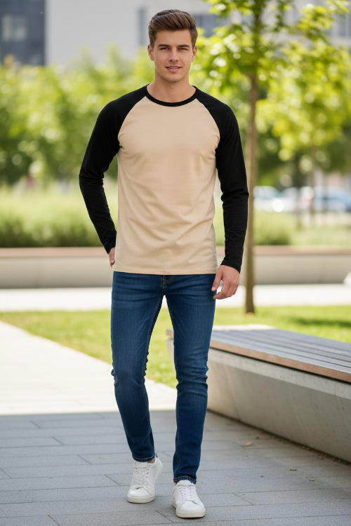 Long-sleeve shirt with black sleeves and beige body on a white background