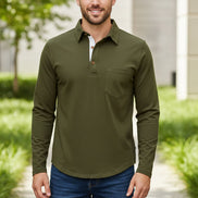 Man wearing a green long-sleeve shirt with a white collar on a white background