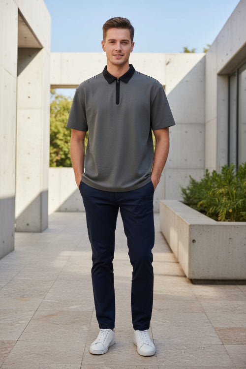 Gray t-shirt with black collar on a light gray background