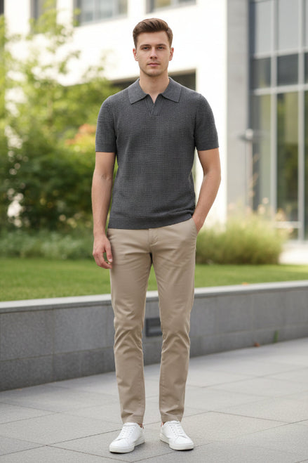 Gray short-sleeve polo shirt on a hanger against a gray background