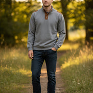 Gray long-sleeve shirt with brown leather accents on a white background