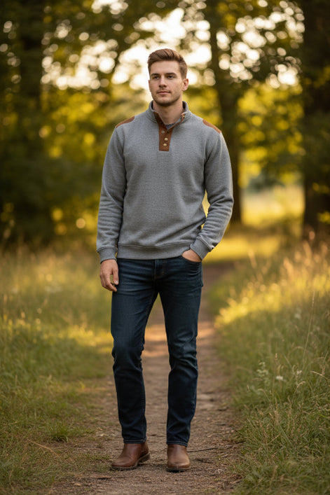 Gray long-sleeve shirt with brown leather accents on a white background