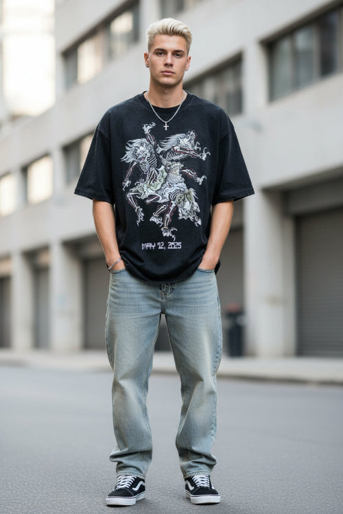 Person wearing a black t-shirt with a skeleton design and text on a beige background