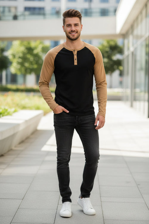 Black and brown long-sleeve shirt with button details on a white background
