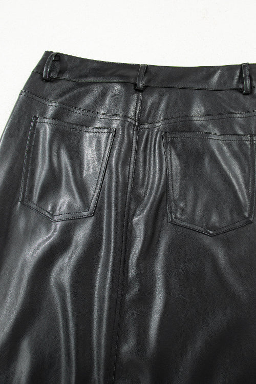 Close-up of black leather pants with a white background