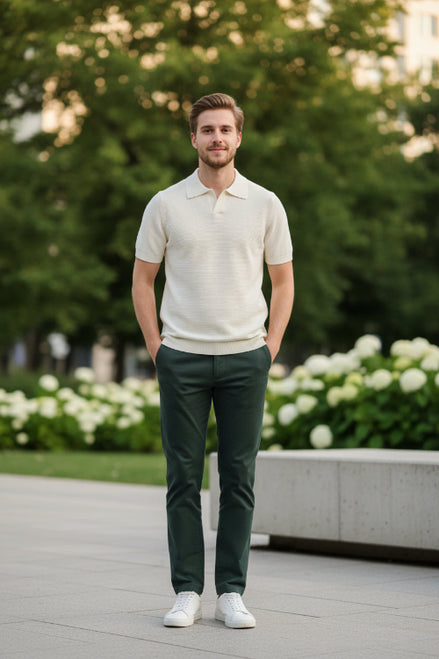 White polo shirt on a hanger against a dark background