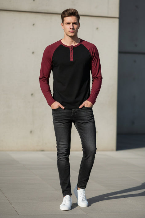 Black and burgundy long-sleeve shirt with button details on a white background