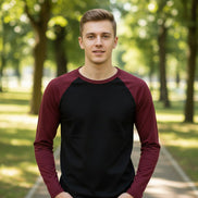 Black long-sleeve shirt with maroon sleeves on a white background