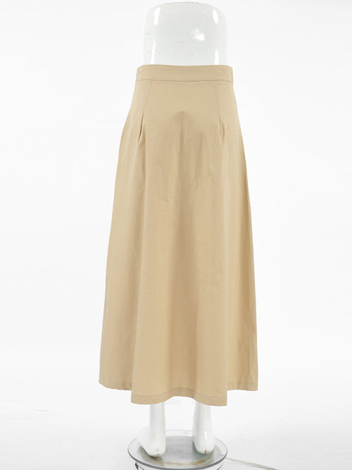 Beige skirt on a mannequin against a white background