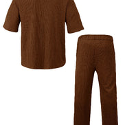 A two-piece men's pajama set in a textured brown corduroy-like fabric, showing the back view of a short-sleeve top 