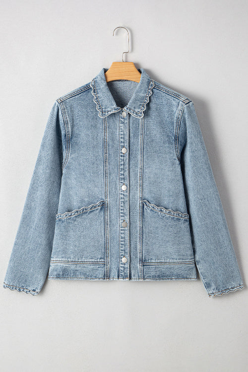 Light blue denim jacket with ruffled collar on a hanger against a white background