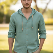 Light blue hooded shirt with buttons on a white background