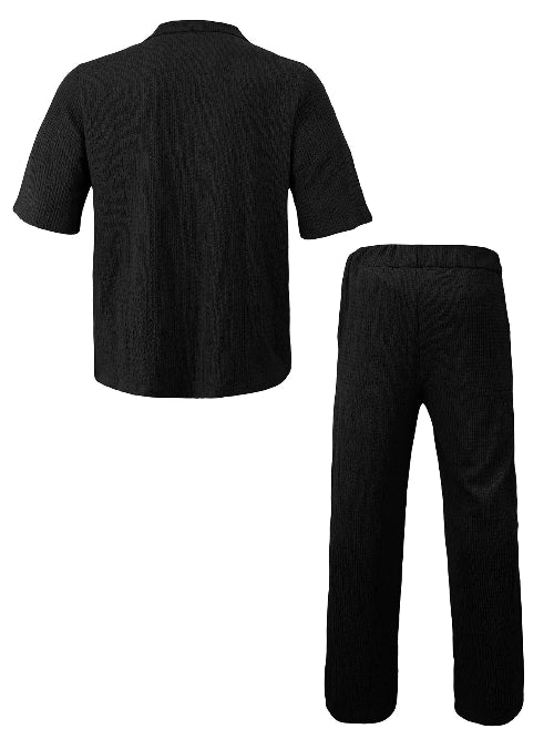 A two-piece black ribbed lounge set consisting of a short-sleeve button-up shirt and matching straight-leg pants, 