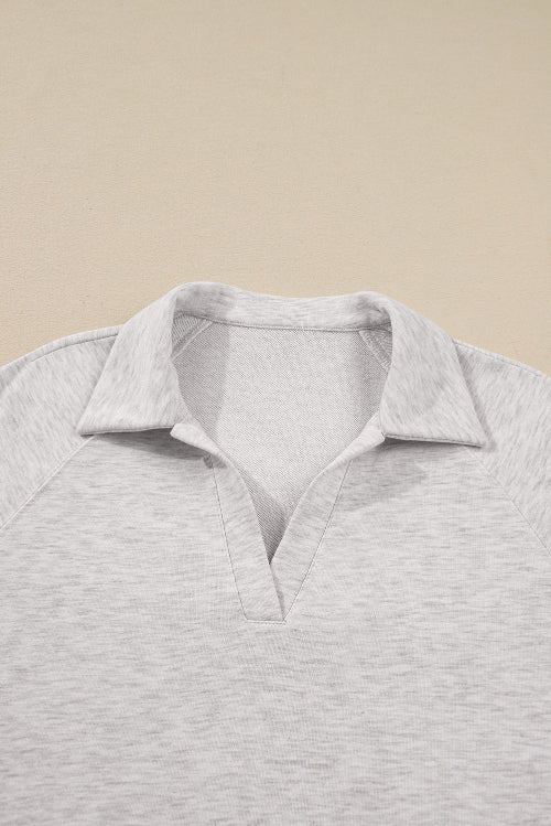 Gray polo shirt on a beige background