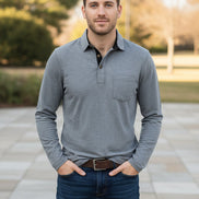 Gray long-sleeve polo shirt worn by a person on a white background