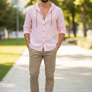 Pink button-up shirt with a hood on a white background