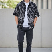 Black and white patterned shirt over a white t-shirt on a white background