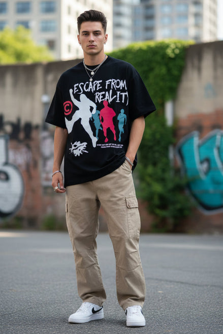 Person wearing a black t-shirt with 'Escape from Realit' graphic design.