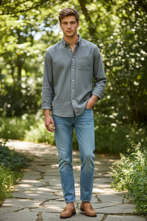 Gray button-up shirt worn by a person on a light gray background