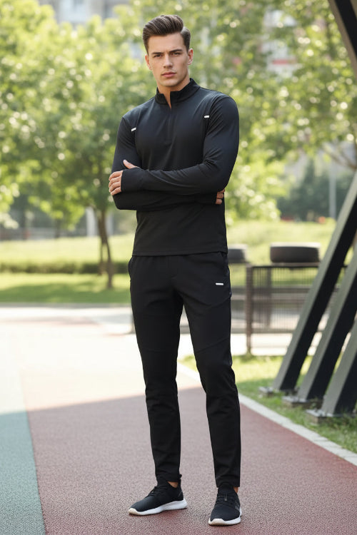 Person wearing a black athletic outfit with a blurred background