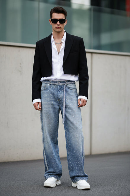 Light blue denim pants with a subtle pattern on a white background