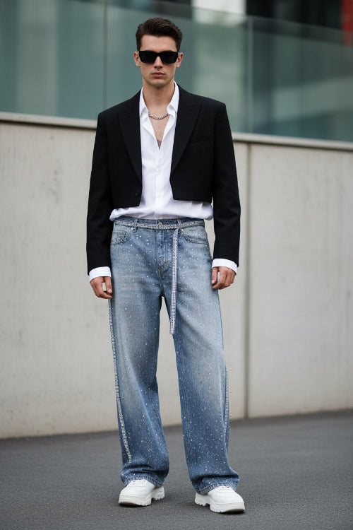 Light blue denim pants with a subtle pattern on a white background