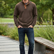 Brown long-sleeve shirt with leather accents on a white background