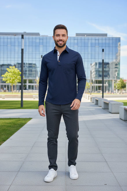 Man wearing a navy long-sleeve shirt with a white collar on a white background