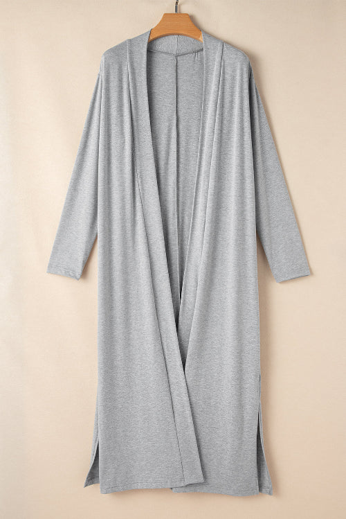 Gray cardigan on a wooden hanger against a beige background
