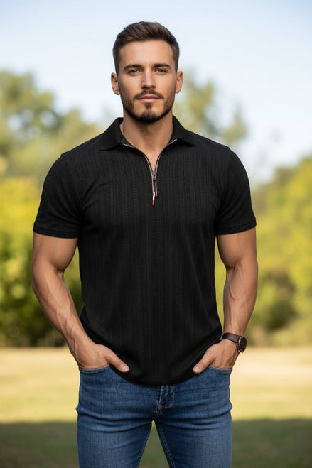 Man wearing a black short-sleeve polo shirt with a zipper on a white background