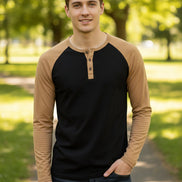 Black and brown long-sleeve shirt with button details on a white background