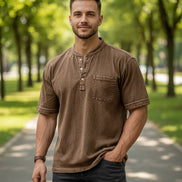 Brown short-sleeve shirt worn by a person on a white background