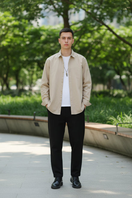 Beige shirt worn by a person on a gray background