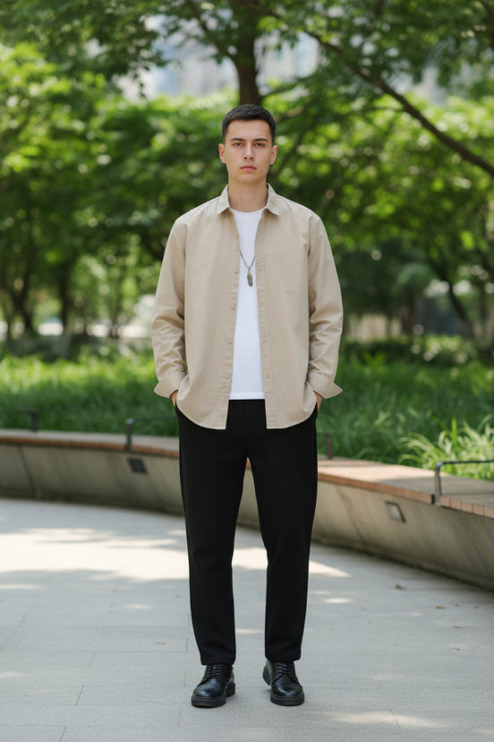 Beige shirt worn by a person on a gray background