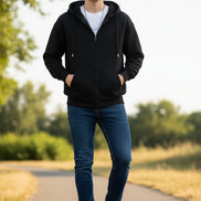Black hoodie worn by a person on a light gray background