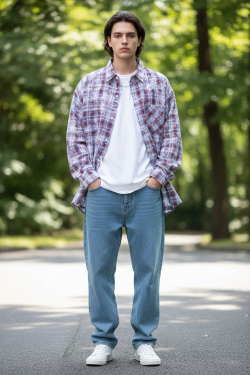 Person wearing a plaid shirt with red and blue patterns on a white background