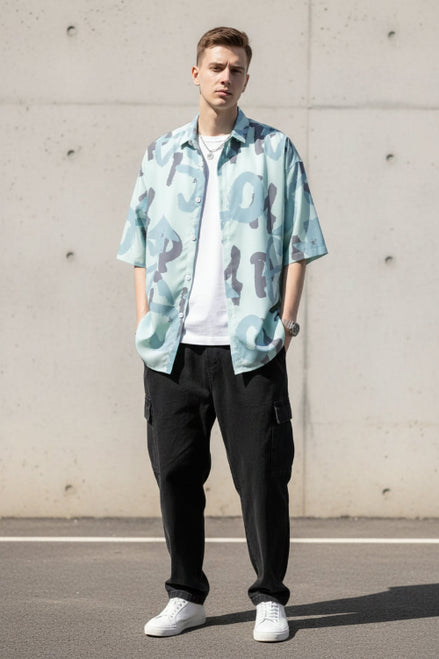 Person wearing a light blue camouflage-patterned shirt with a white background