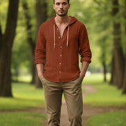 Brown hooded shirt with buttons on a white background