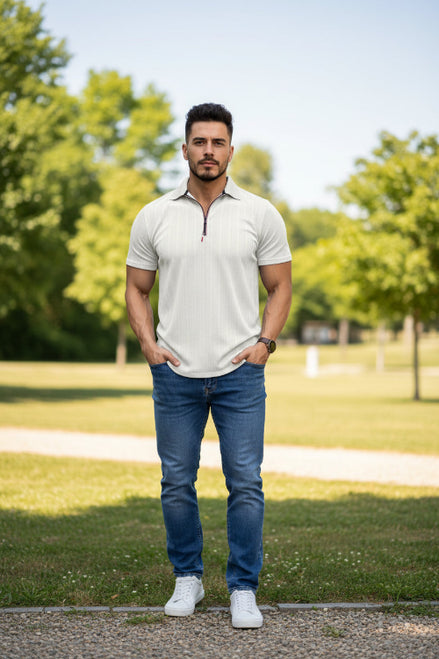 Man wearing a white textured polo shirt with a zipper on a white background