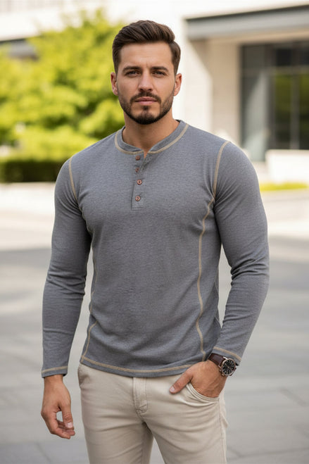 Man wearing a gray long-sleeve henley shirt with beige accents on a white background