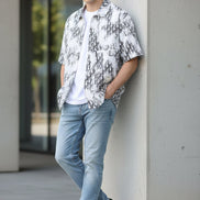 White shirt with black abstract pattern on a white background