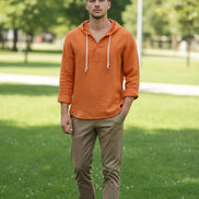 Orange button-up shirt with a hood on a white background