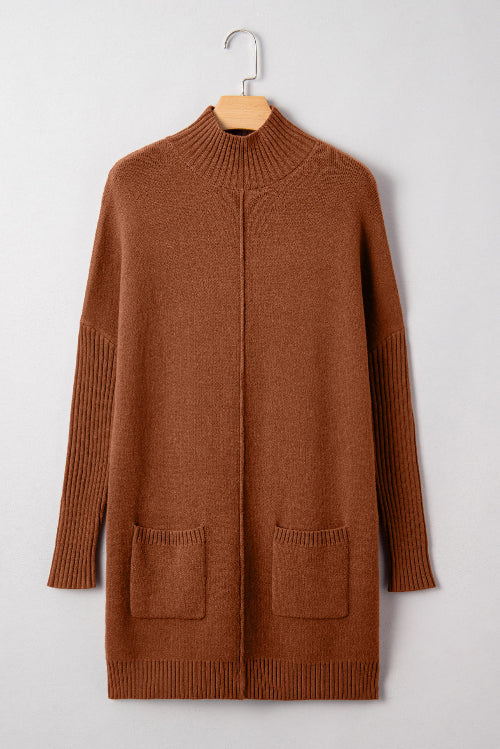 Brown sweater dress on a hanger against a light gray background