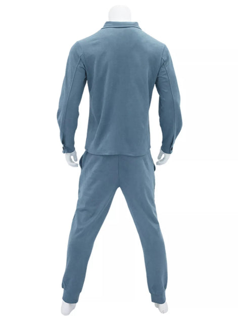 A mannequin wearing a matching two-piece tracksuit in dusty blue, shown from the back 