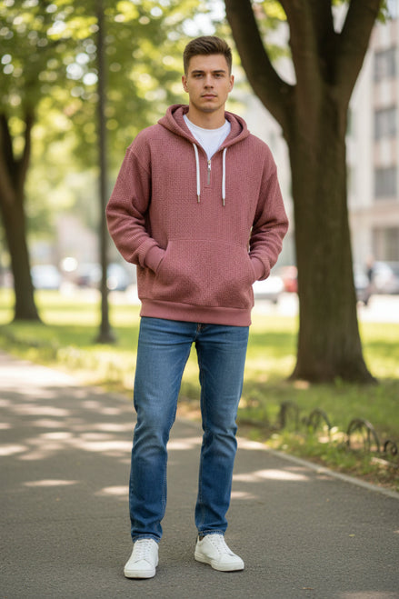 Maroon pullover with a zipper worn by a person on a white background