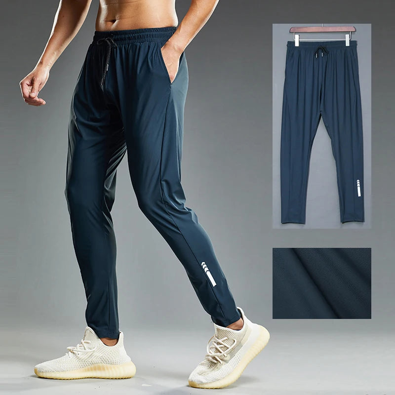 Navy blue athletic pants worn by a person on a gray background with inset images.